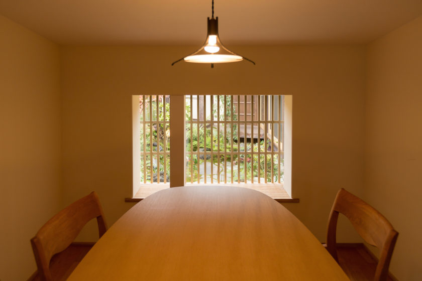 Soft light enters the dining room from the courtyard